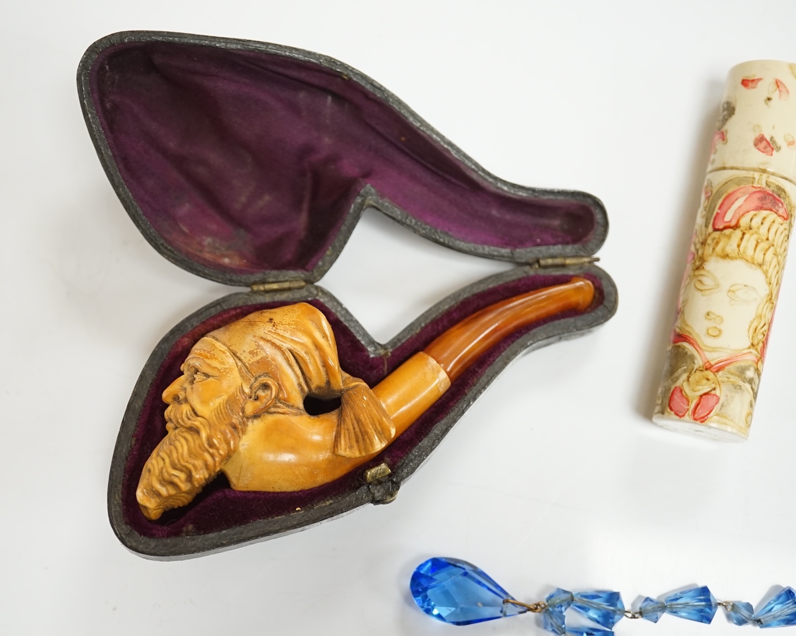 A small group of collectables including a cased Meerschaum pipe, a Dunhill lighter, a yellow metal mounted nephrite pendant, 53mm, yellow metal mounted amber cigarette holder in a silver case, Eloga wrist watch, etc. Con